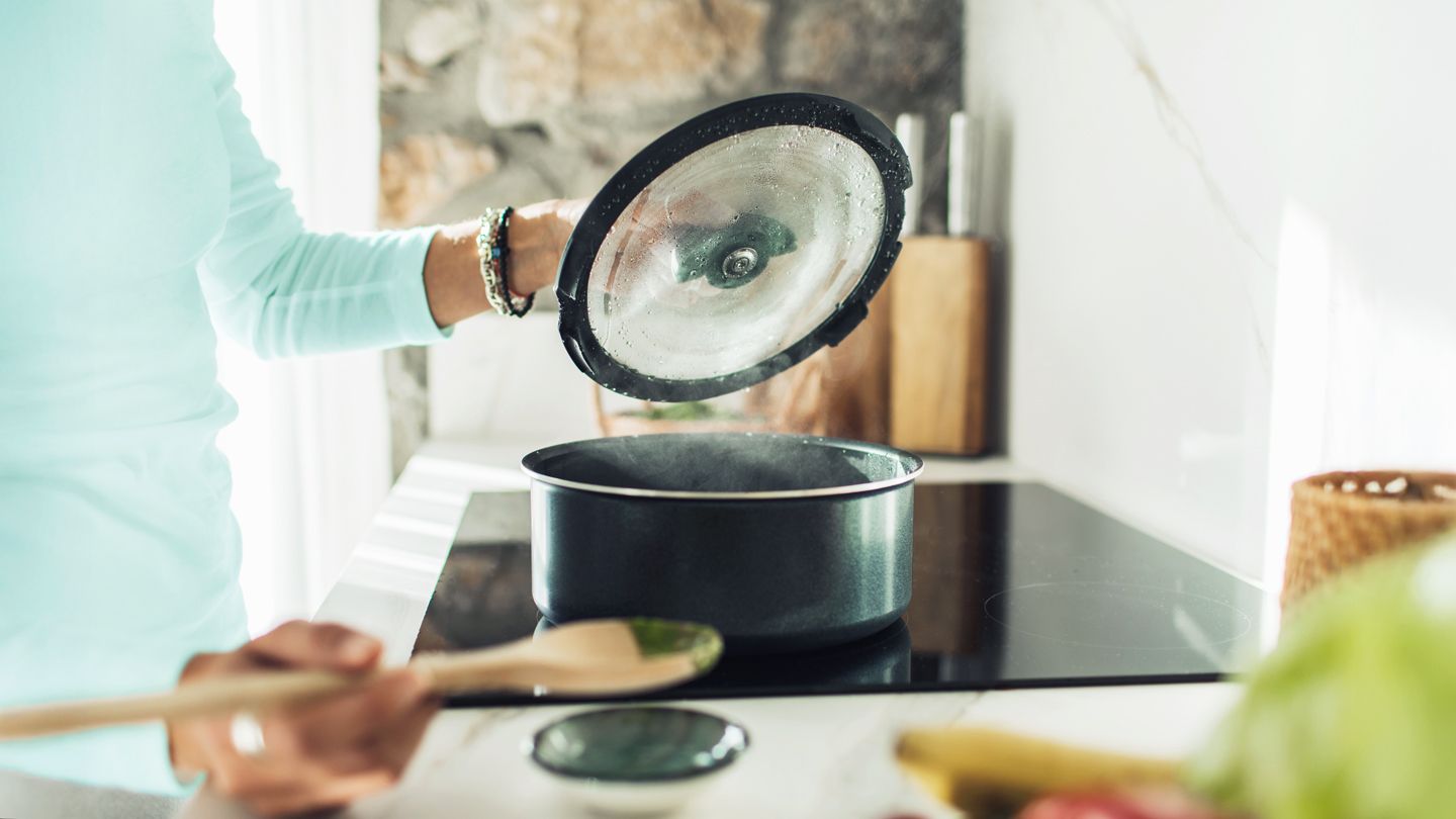Woman making soup at home