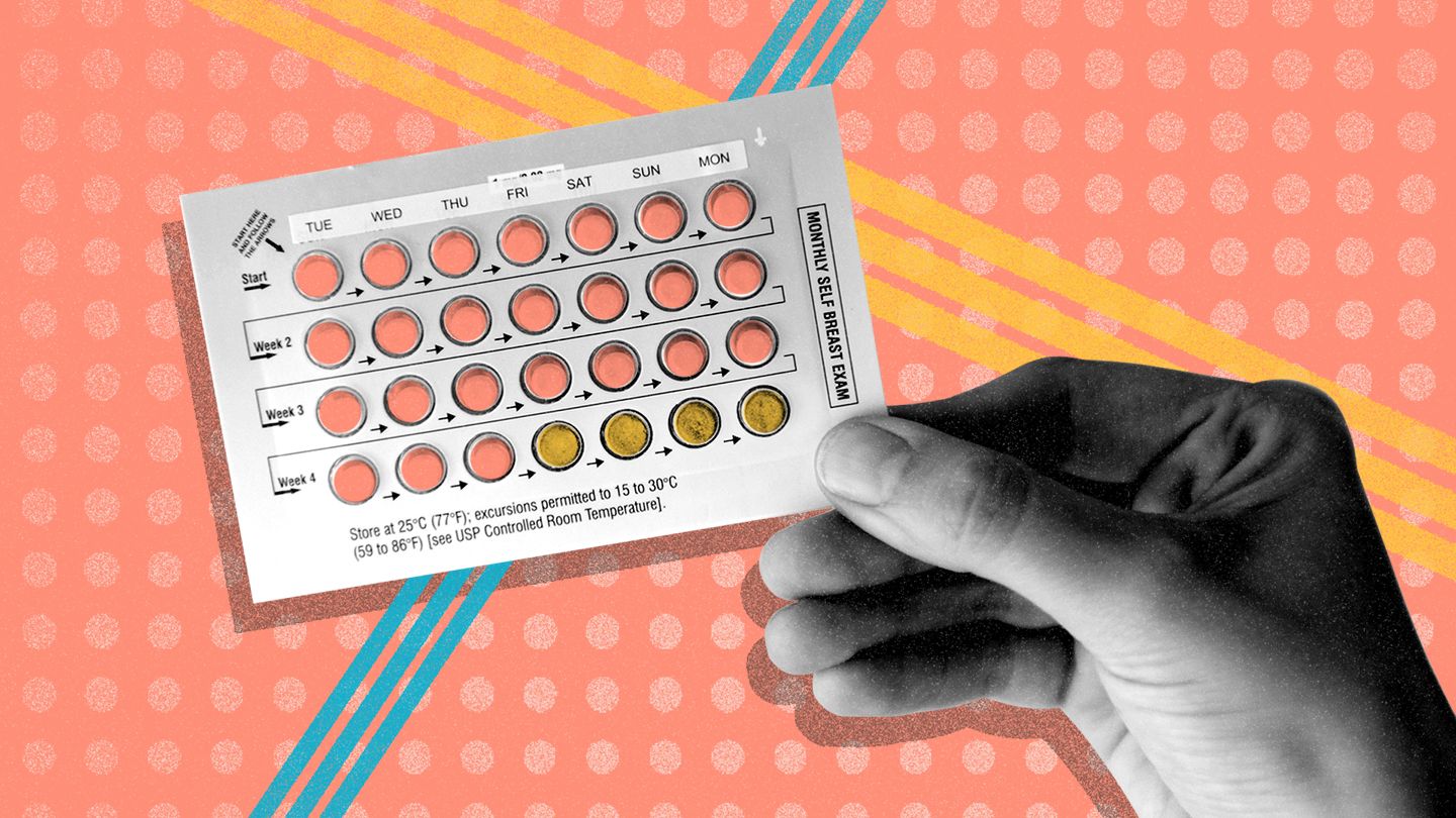woman holding birth control blister packet 