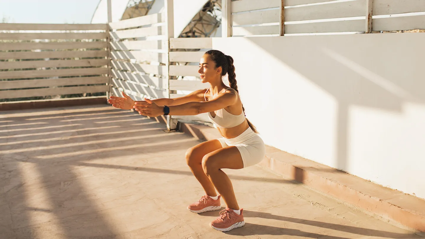woman doing body weight squat