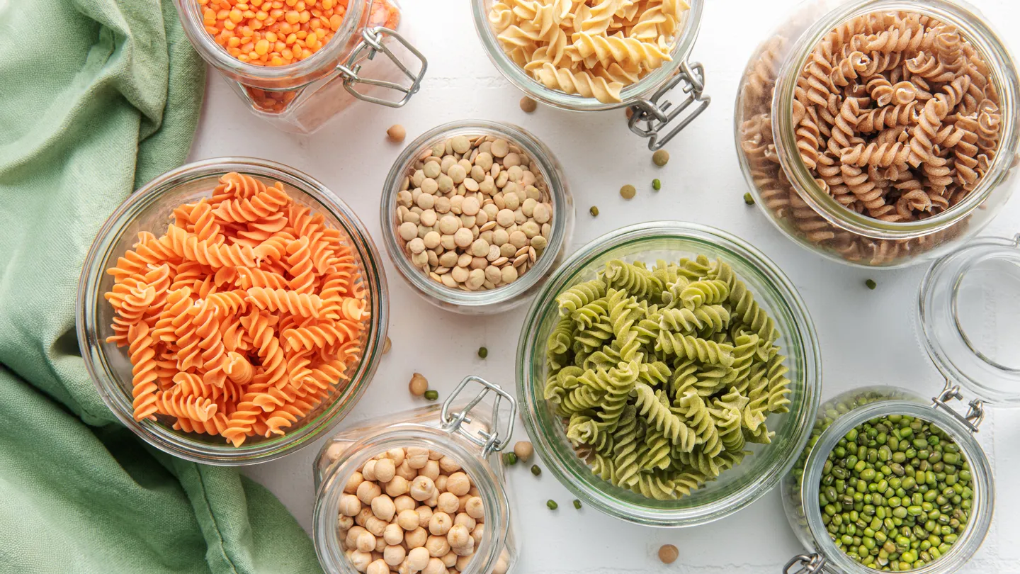 variety of types of pasta on kitchen counter