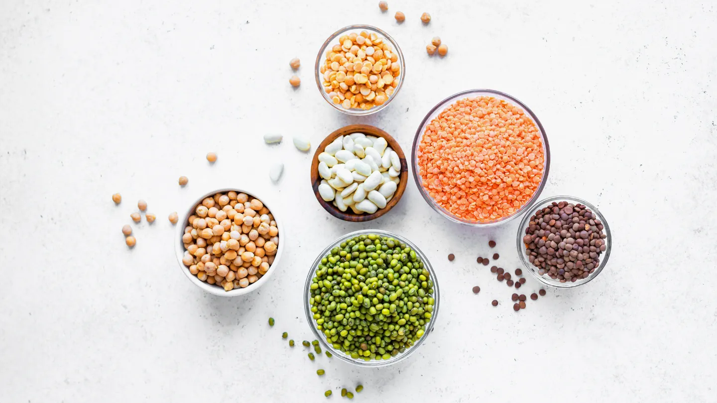 a variety of lentils, beans and pulses in bowls