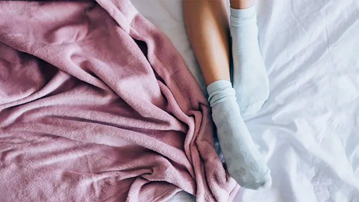 a woman laying in bed