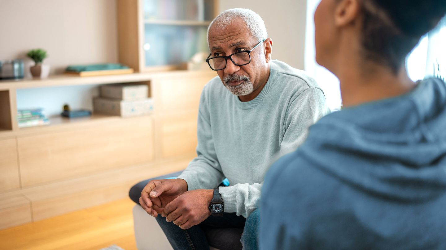 black man discussing his health with his adult child