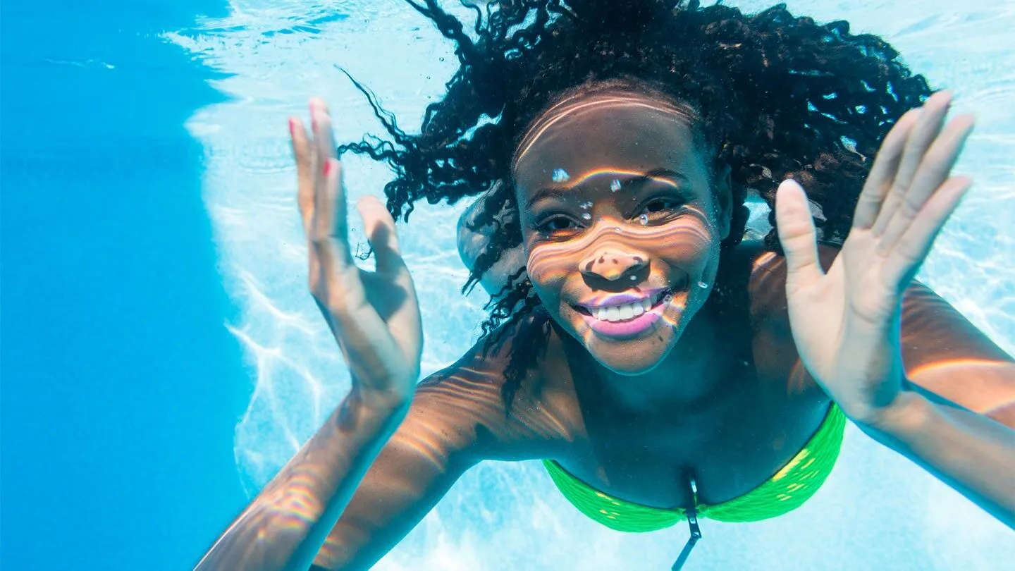 a woman with allergies swimming in a pool