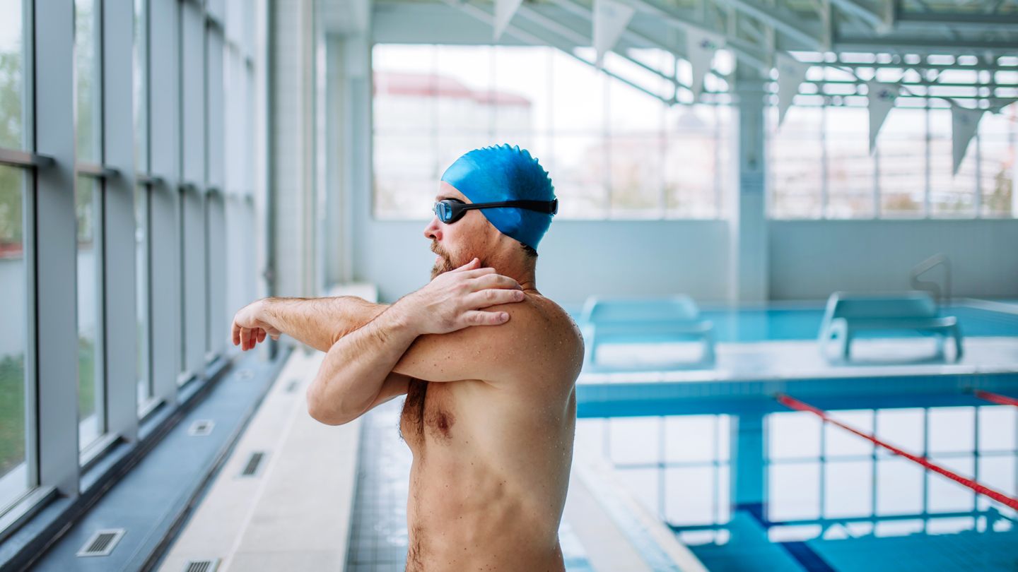 man stretching before swim