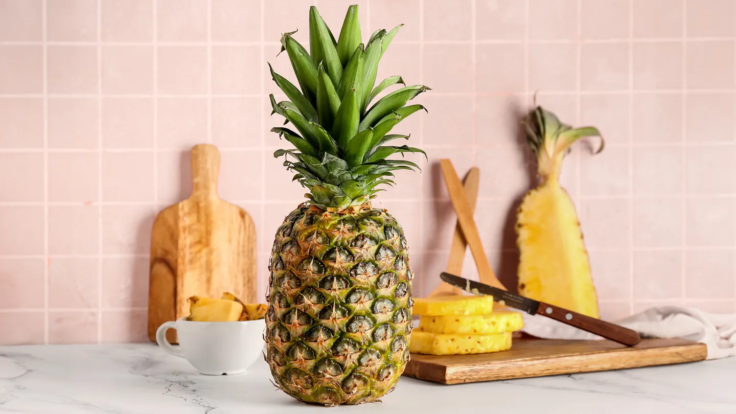 Fresh pineapple on countertop in kitchen