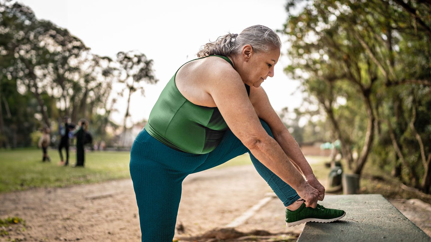 senior woman about to go on a walk for exercise outdoors