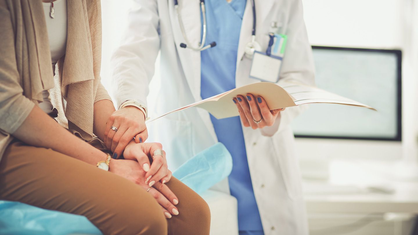 woman speaking with doctor