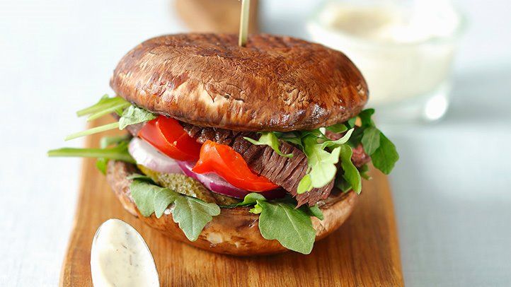 a burger with portobello mushrooms as a bun alternative