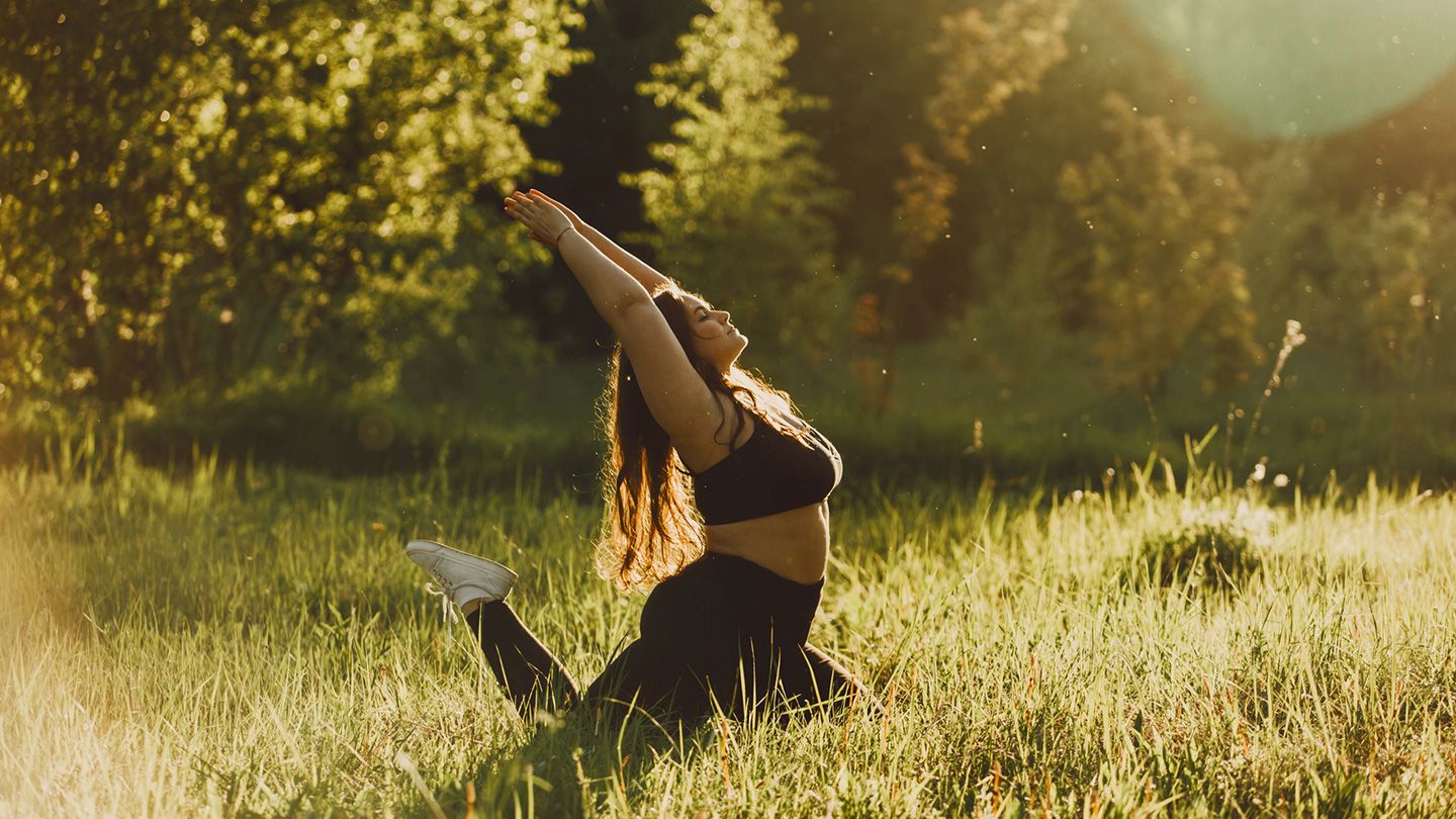 woman doing yoga outside