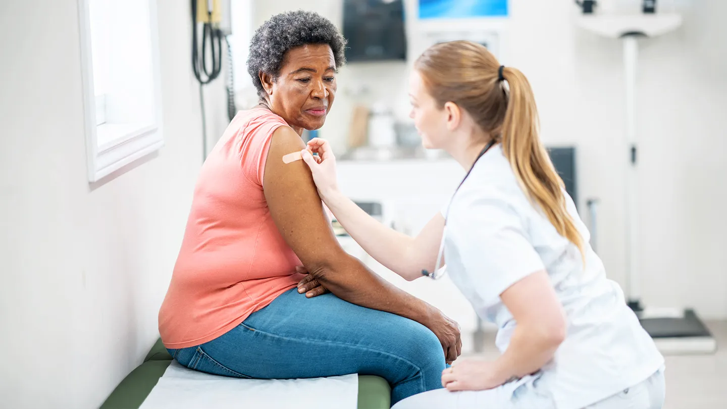 Woman receiving vaccine shot