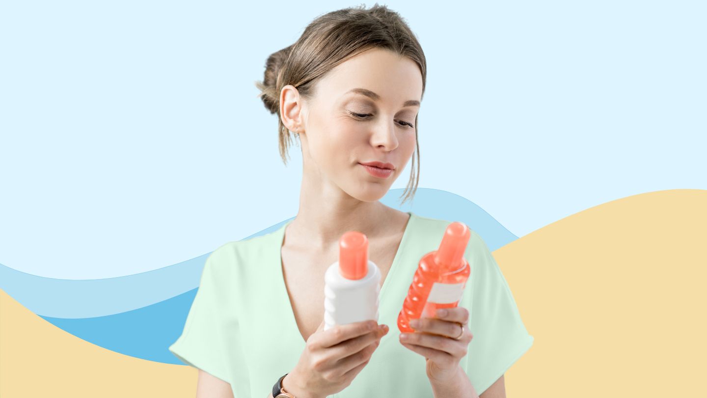 young woman looking at two different bottle of sunscreen spf