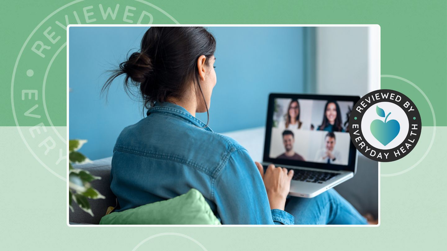 Woman on small group video call from laptop at home