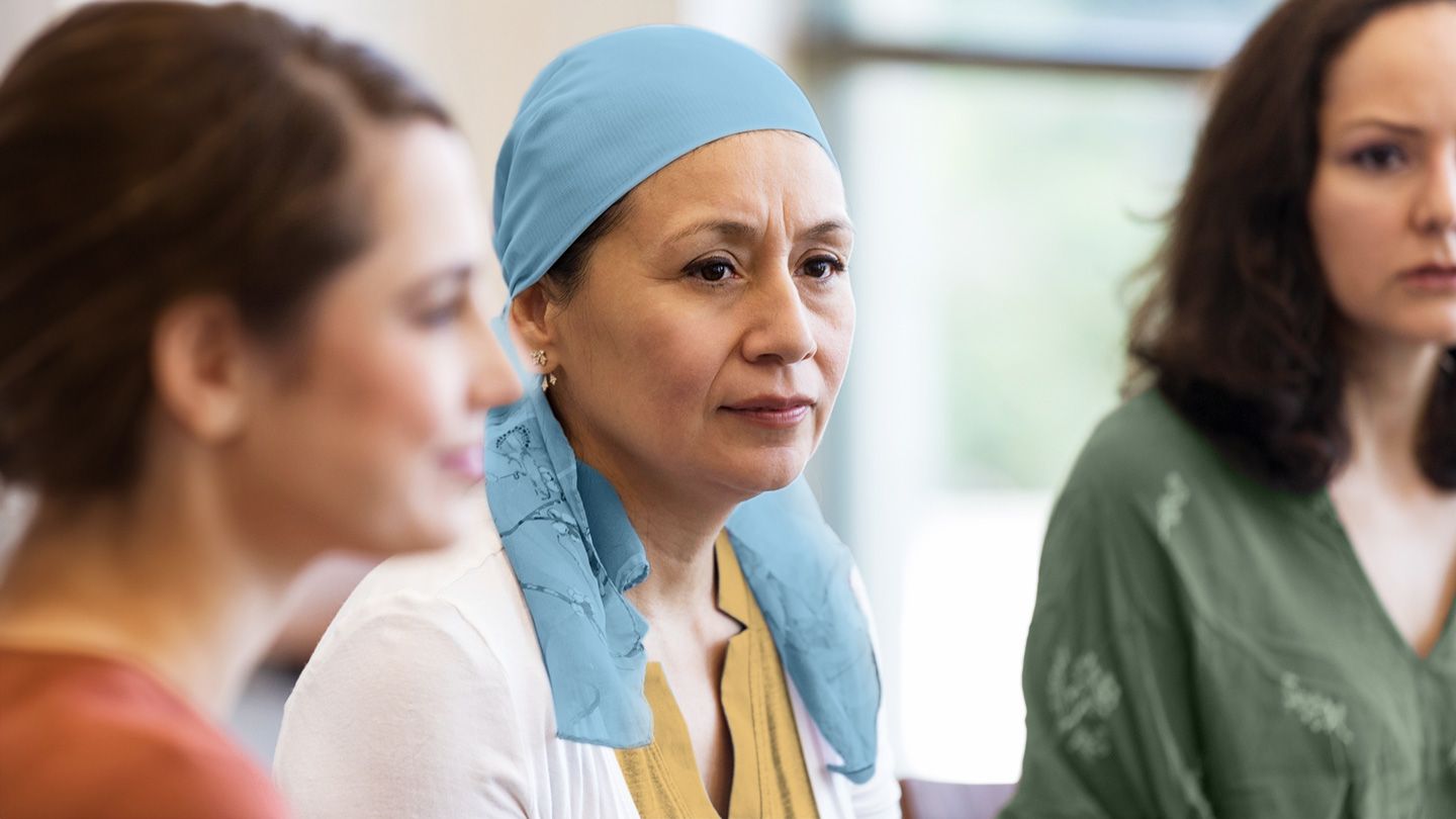 woman wearing head scarf in group of women