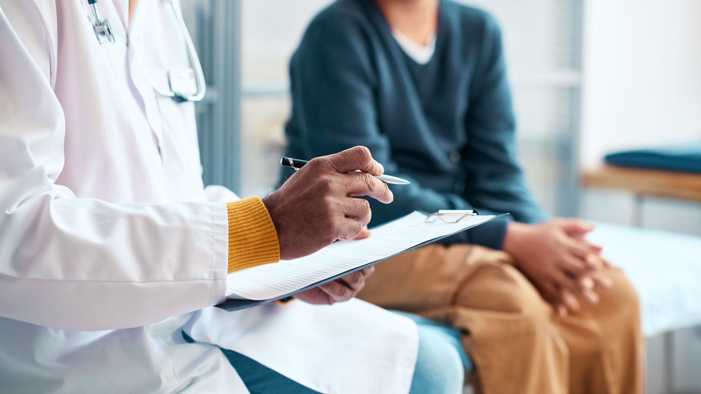 child teen talking with doctor about changes in bowel habits