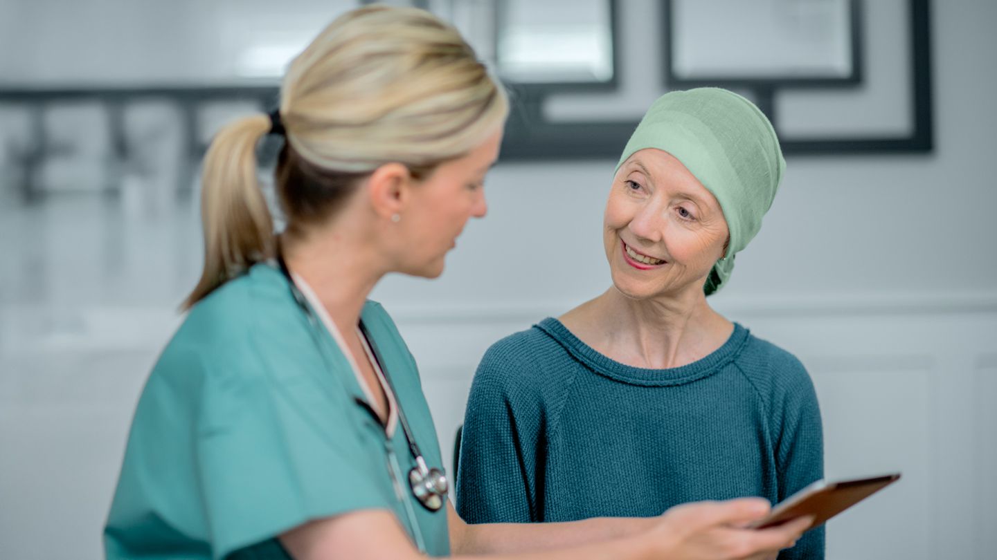 female cancer patient talking with her doctor
