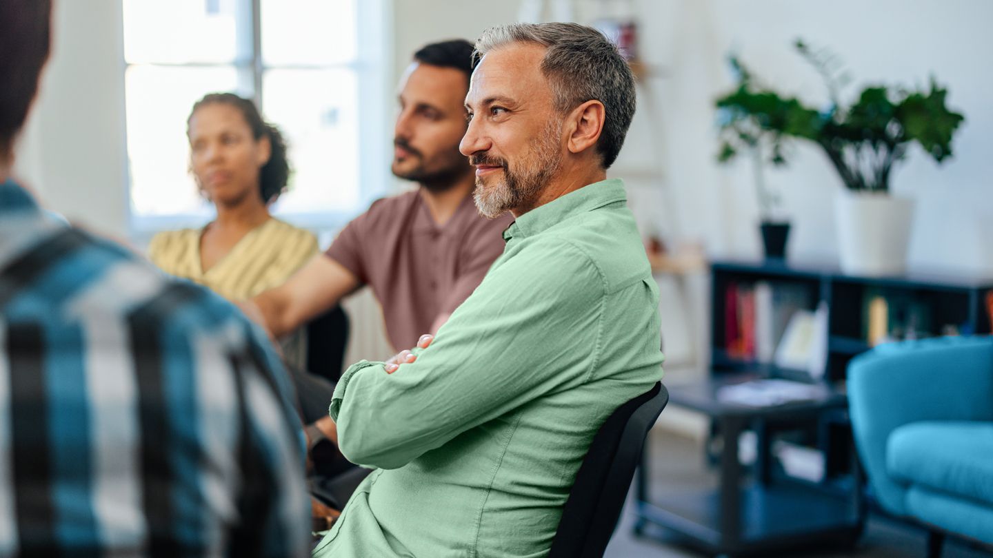 adult support group therapy session men and women