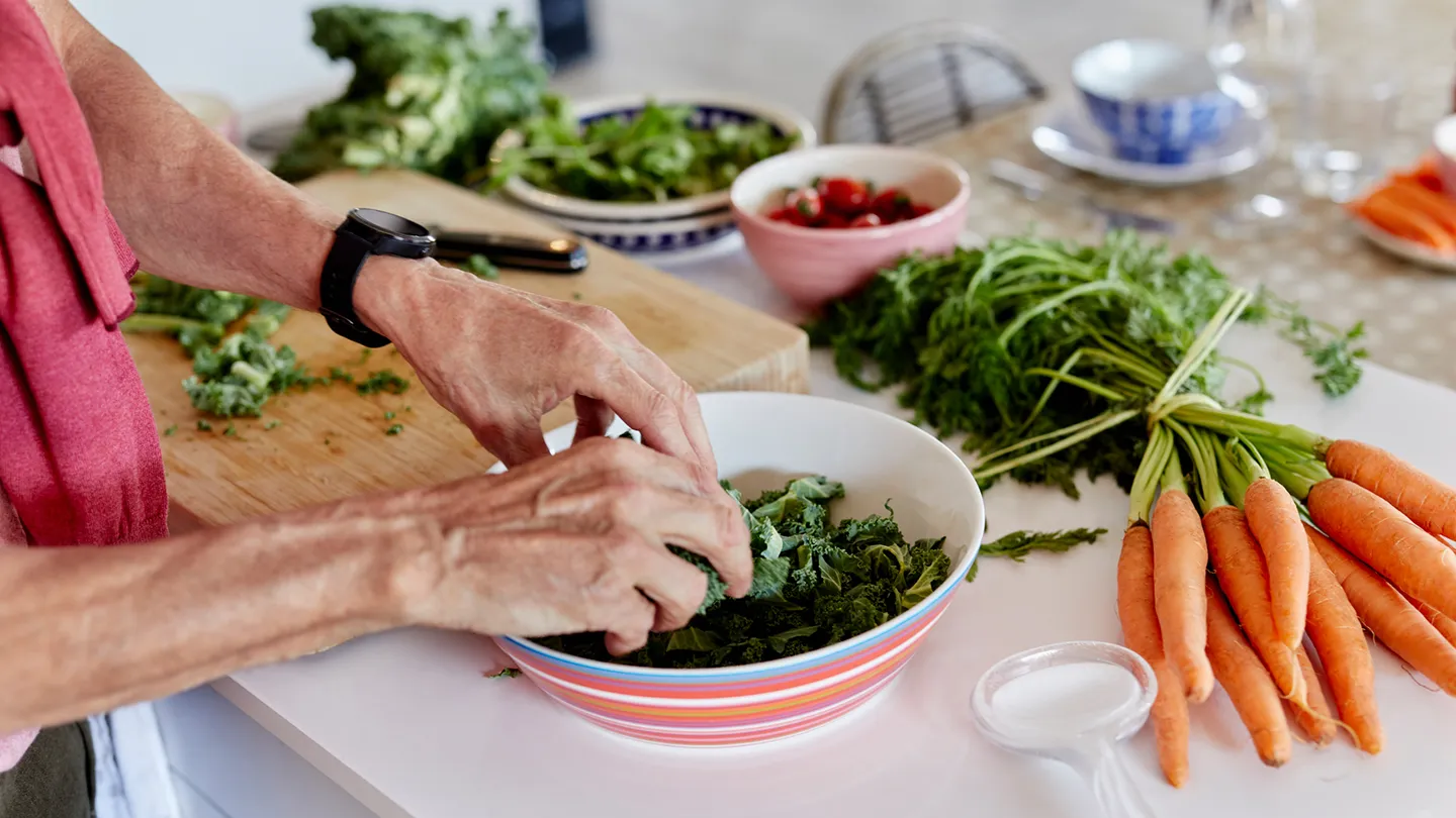 preparing vegetables salad in bowl kitchen