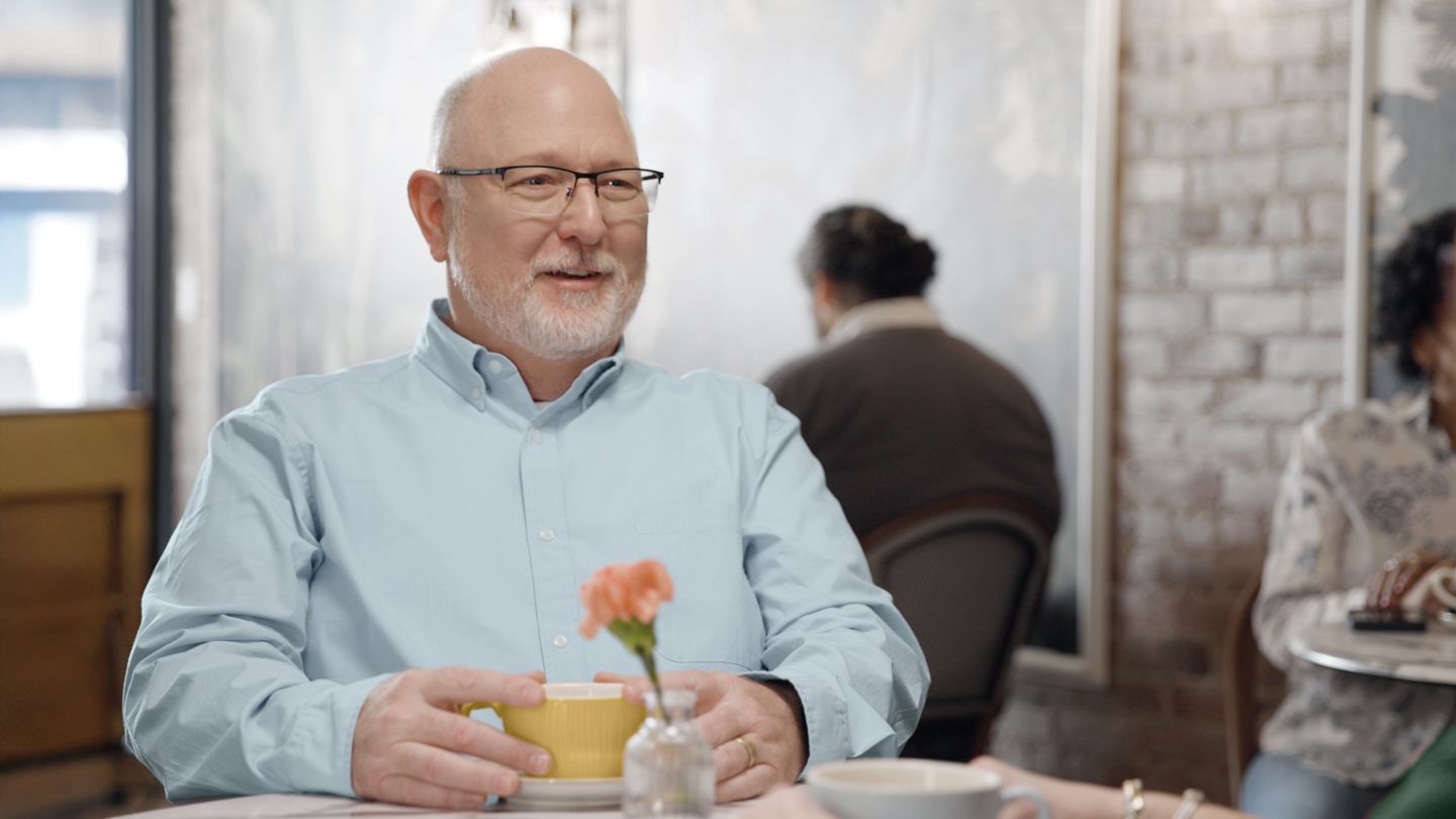man sitting in restaurant talking