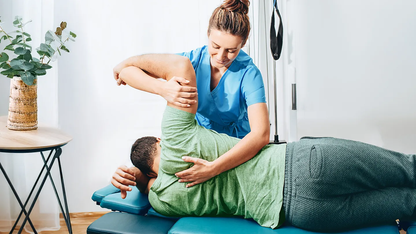 doctor helping man with psoriatic arthritis