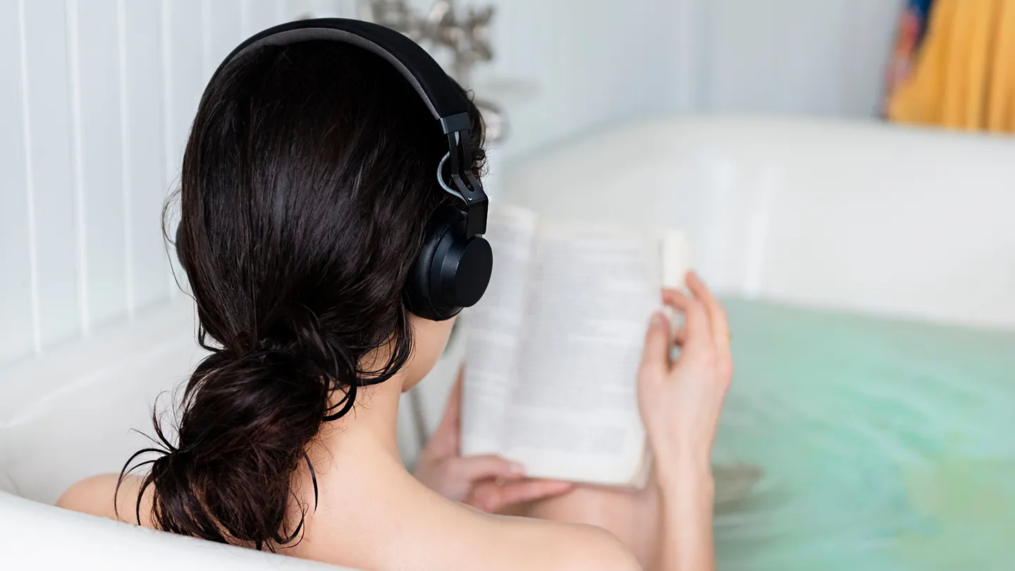 woman in bathtub reading