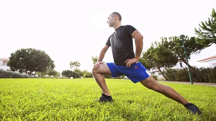 a person with osteoarthritis of the knee stretching before exercise