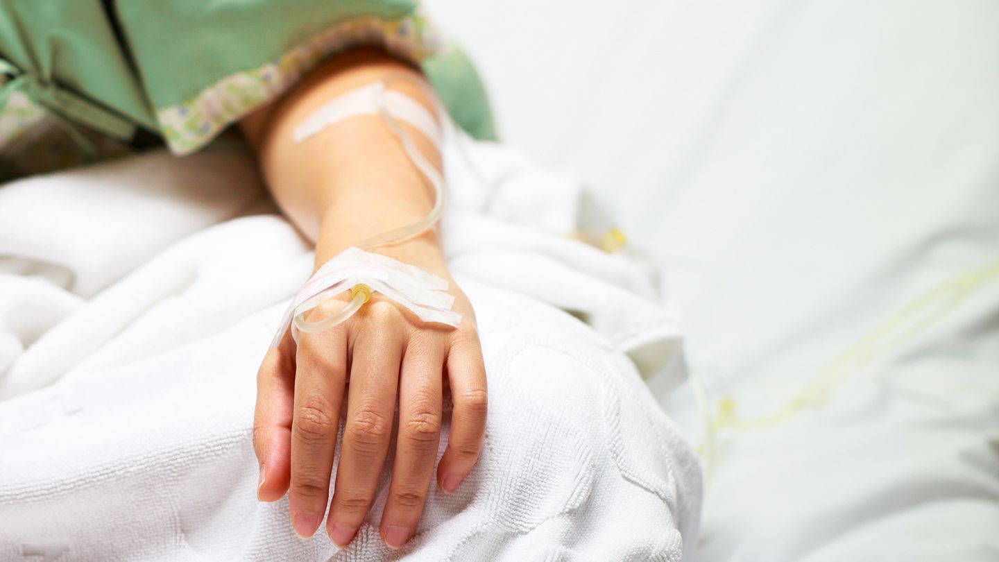 patient receiving IV fluids and antibiotics in the hospital