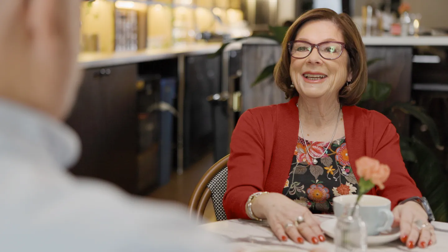 woman sitting in a restaurant talking