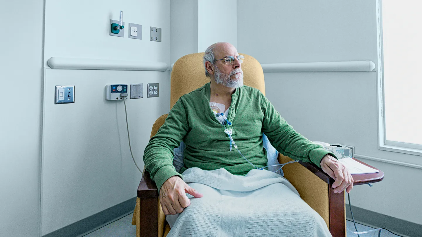 older man receiving chemotherapy for cancer treatment