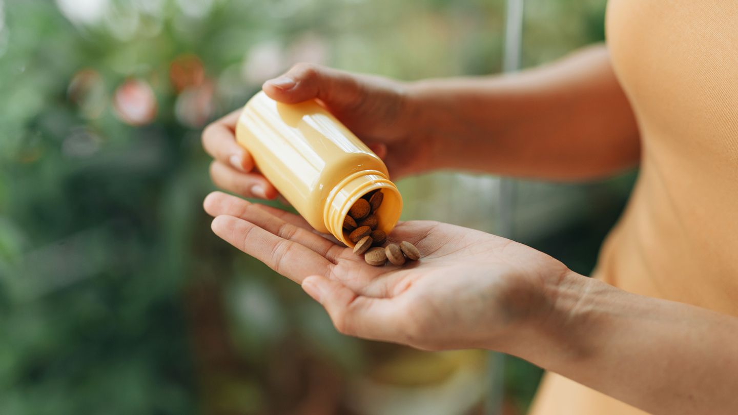 woman taking vitamins