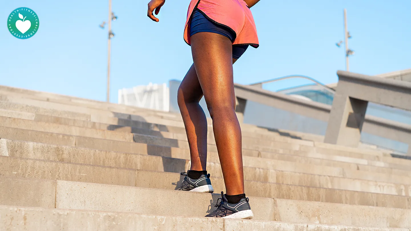 woman walking up the stairs outdoors