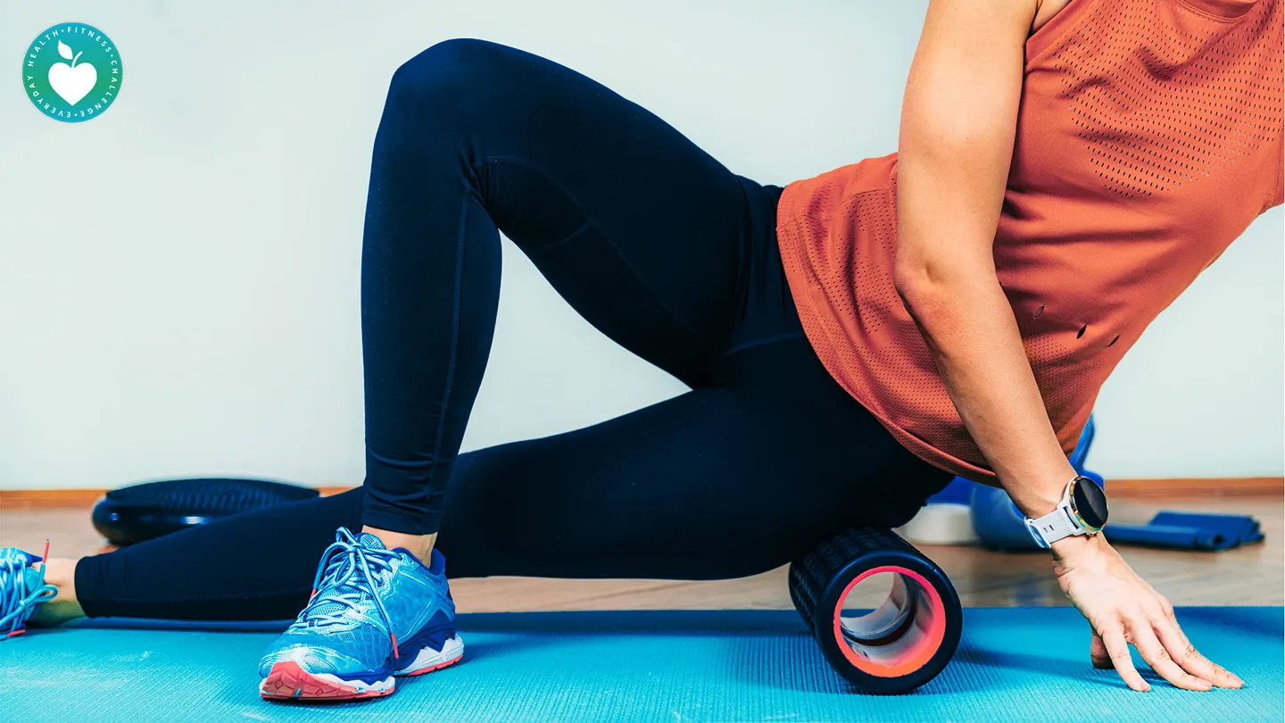 woman using foam roller at home