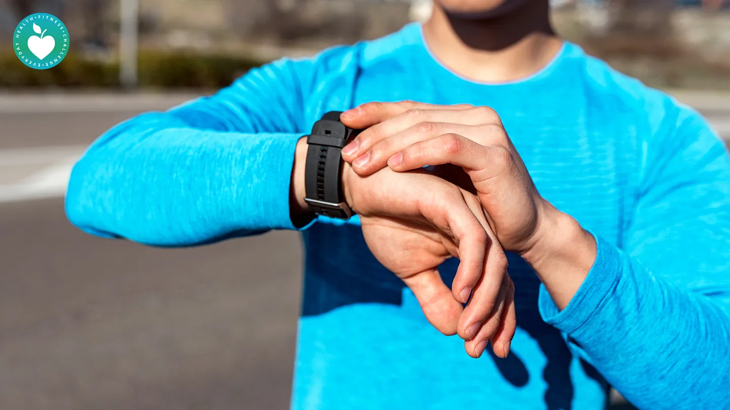 man checking fitness app watch