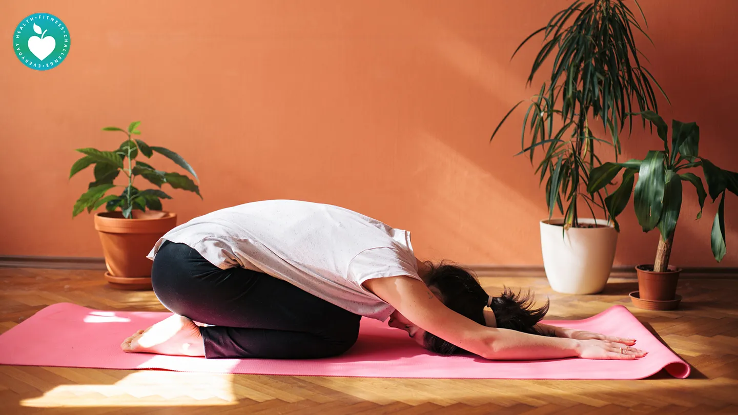 woman doing yoga indoors