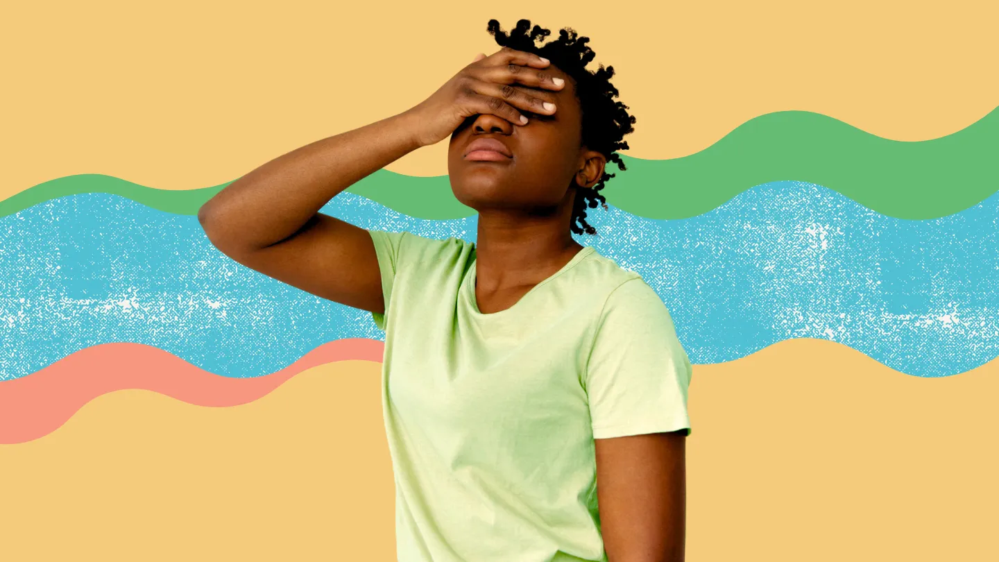 woman covering her face with hand