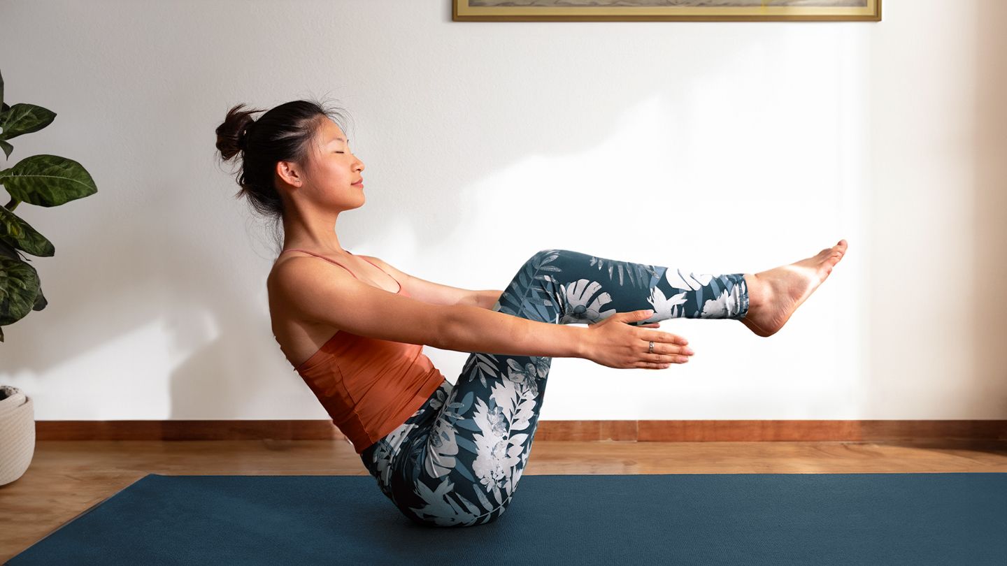 woman doing pilates at home