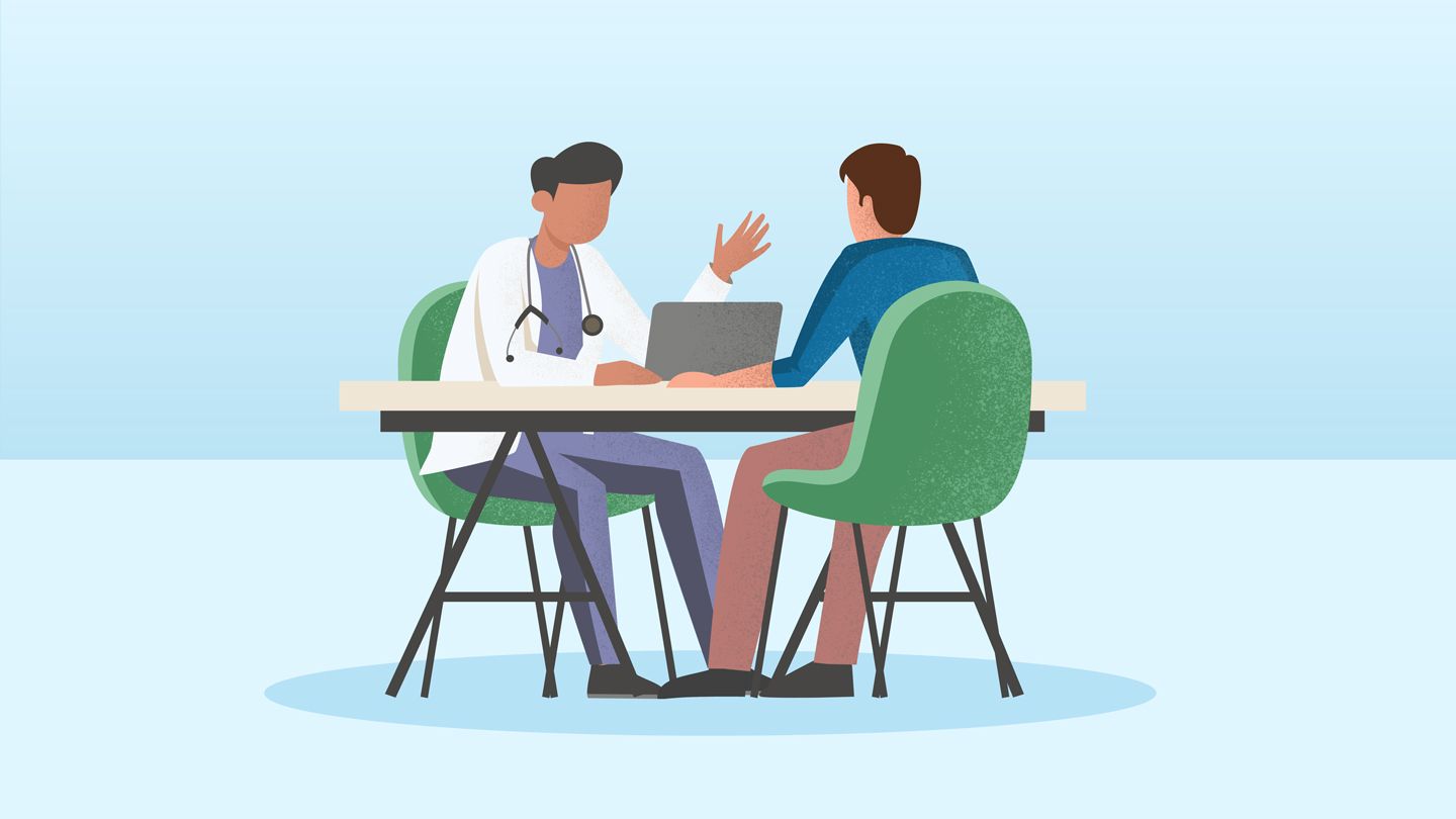 man talking with his doctor in office