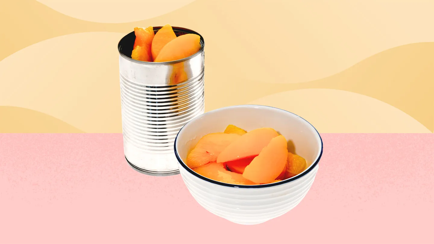 opened can of canned peaches and canned peaches in a bowl on yellow and coral geometric background