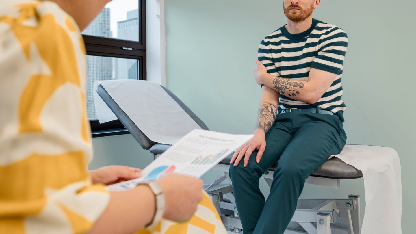 gay man in his doctor's office getting test results