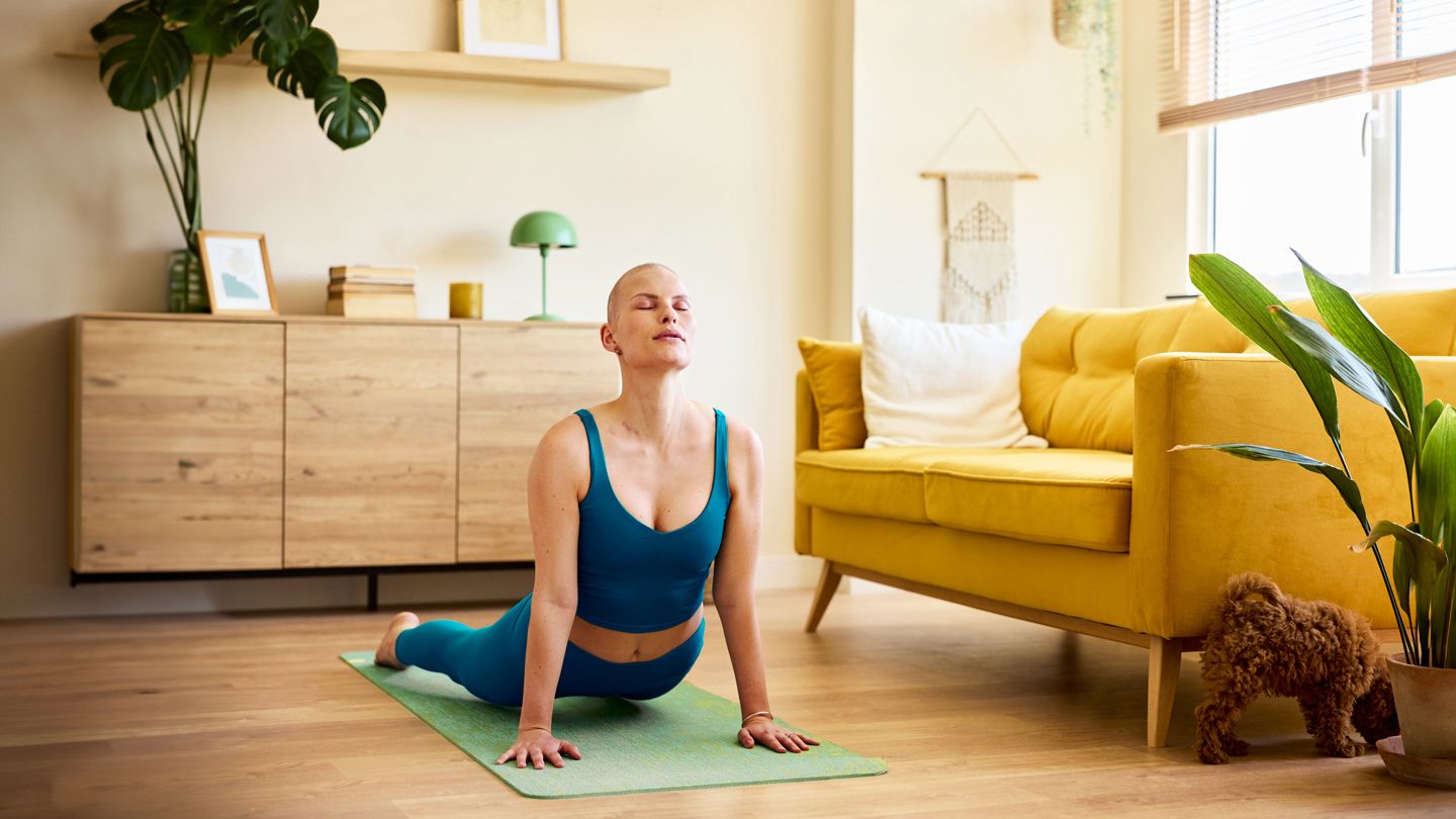 woman going through chemotherapy doing yoga