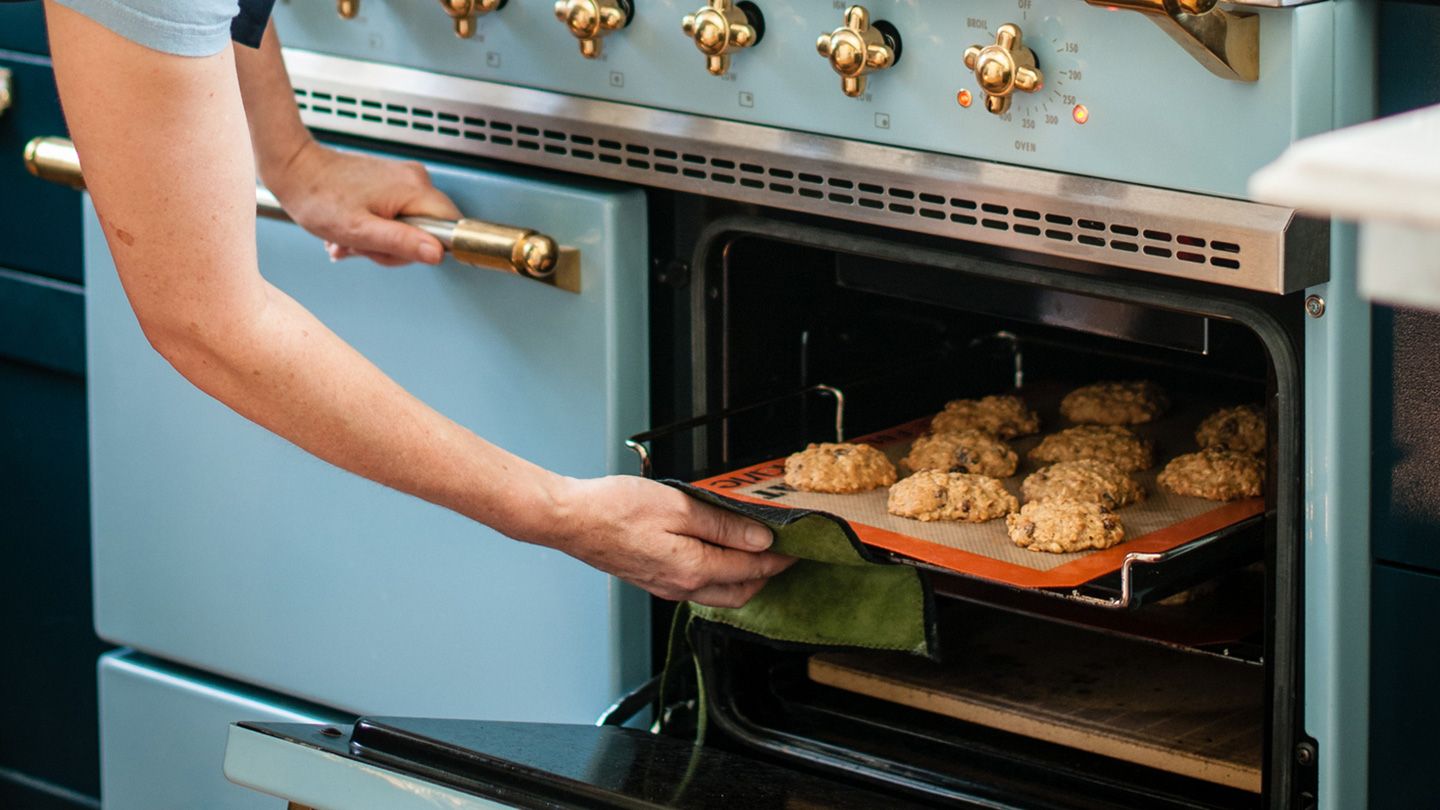 taking oatmeal cookies out of the oven