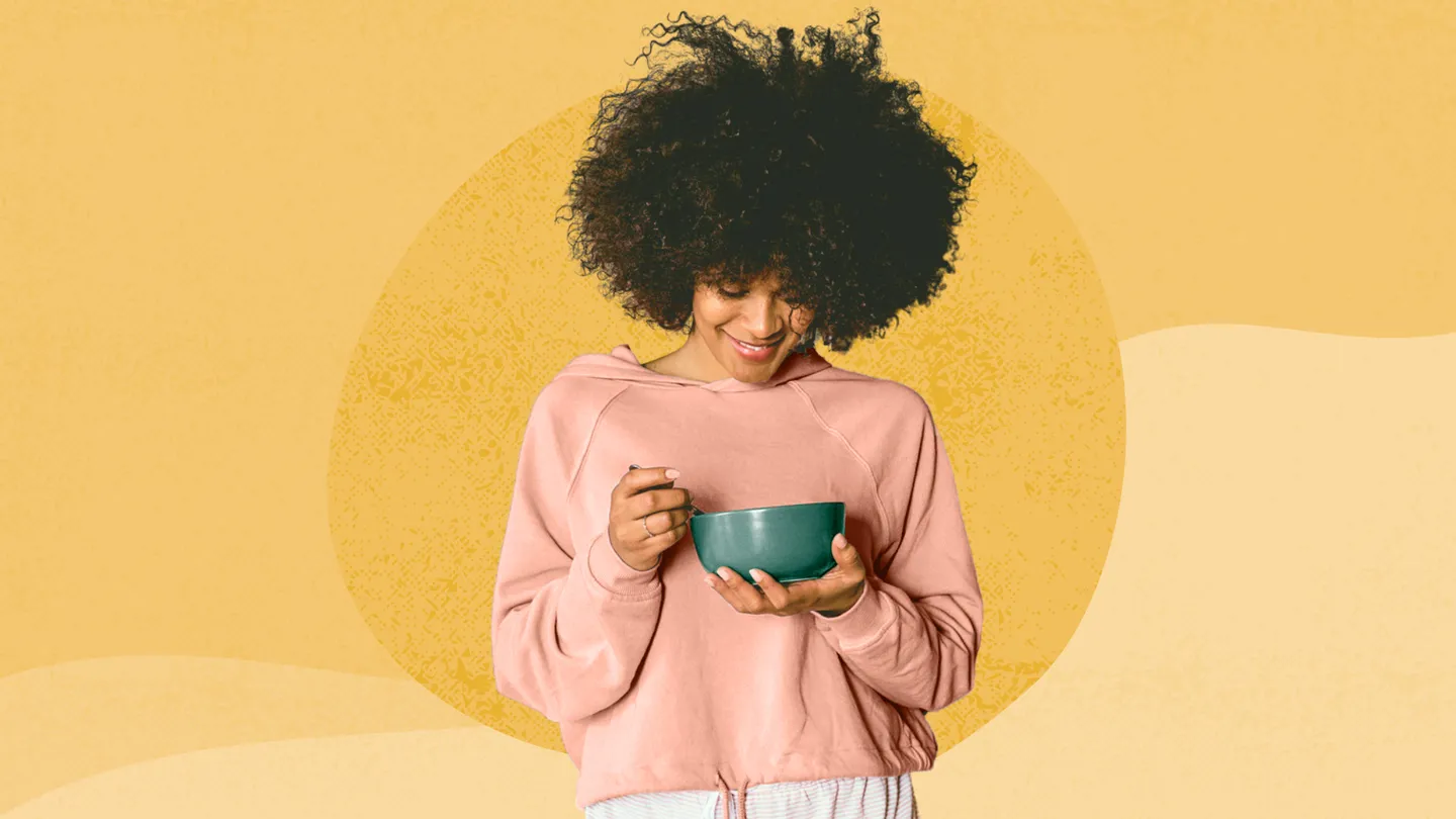 woman eating out of a bowl
