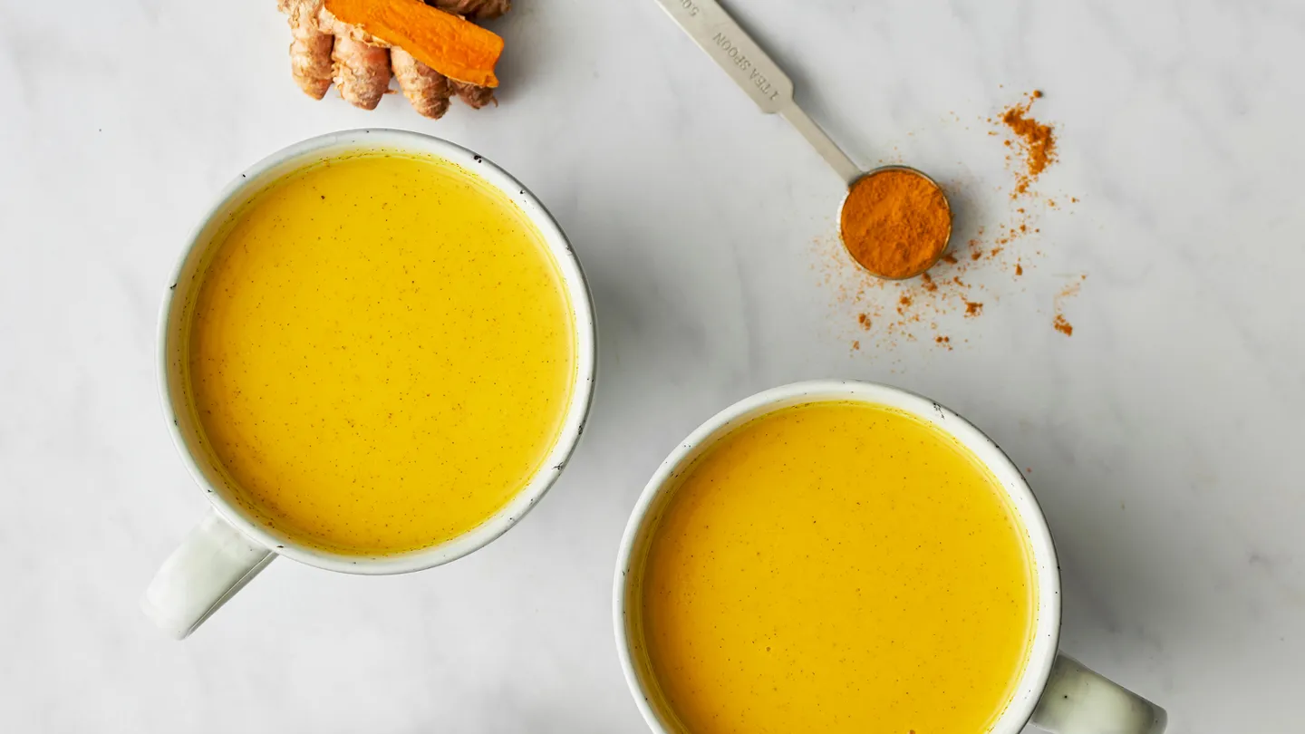 two cups of turmeric and ginger tea