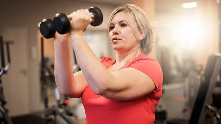 a woman strength training