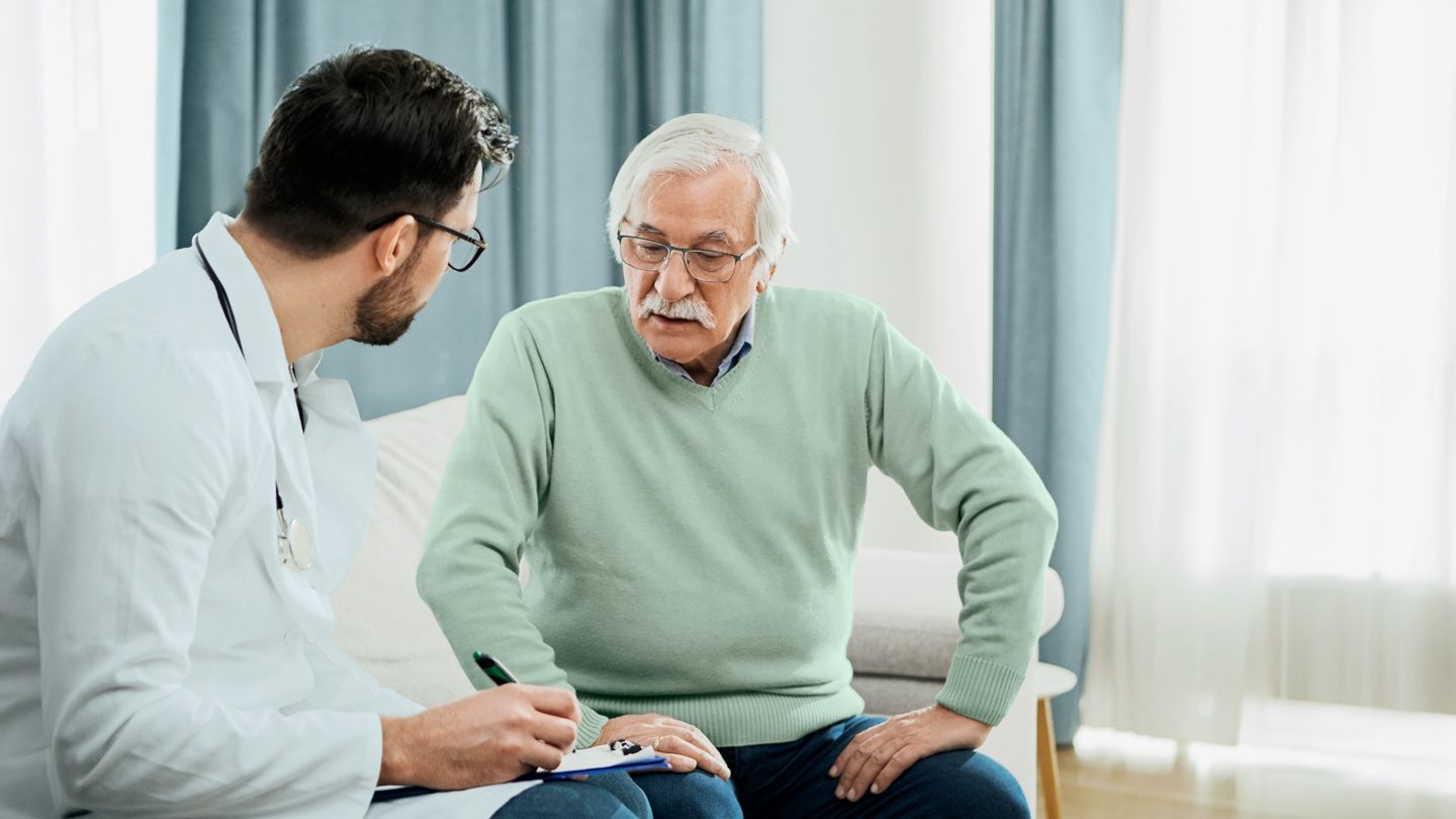 senior male patient discussing options with his doctor