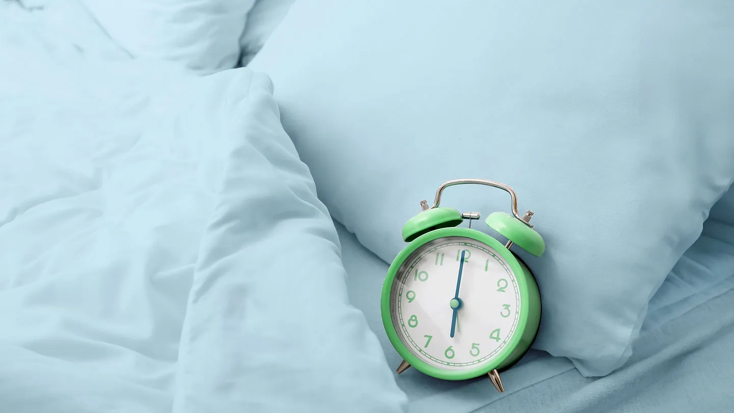 alarm clock in bed