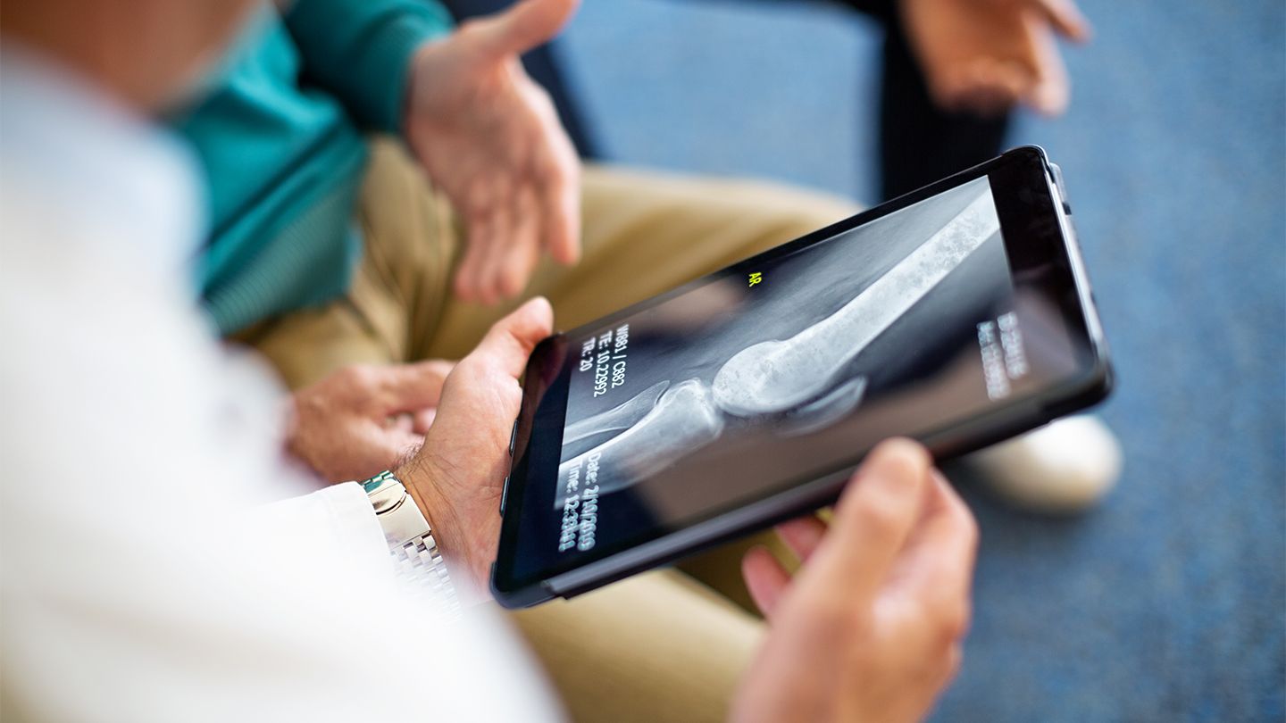 doctor showing xray to patient
