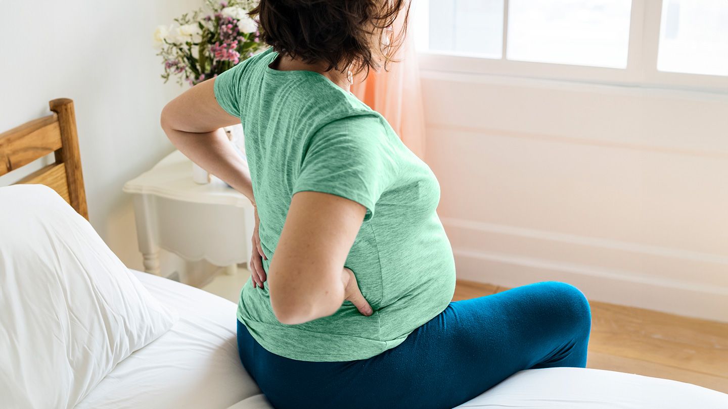 pregnant woman in bed with back pain