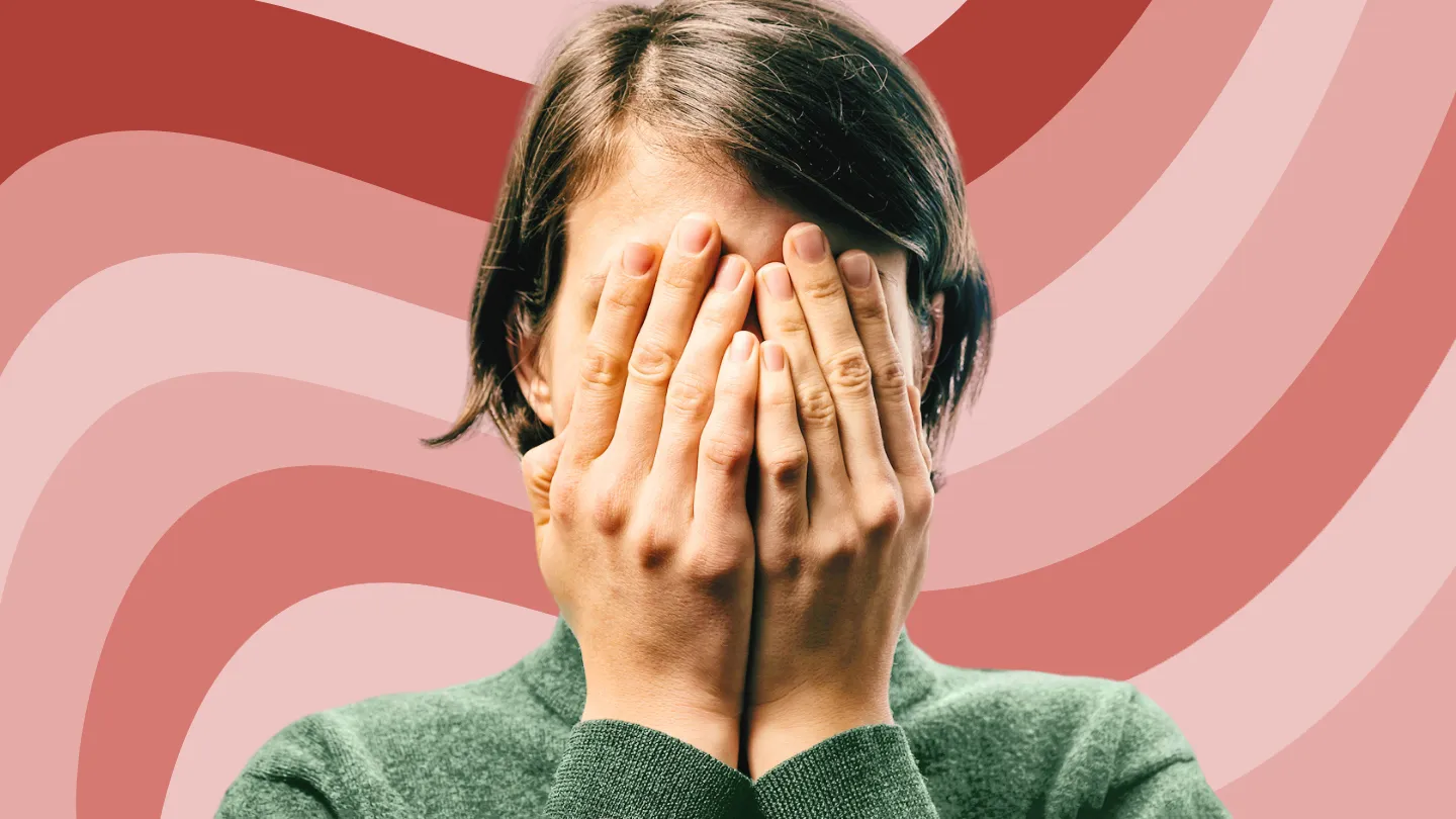 young woman covering her eyes feeling overwhelmed