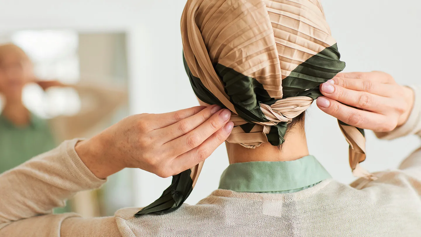 woman protecting scalp with scarf